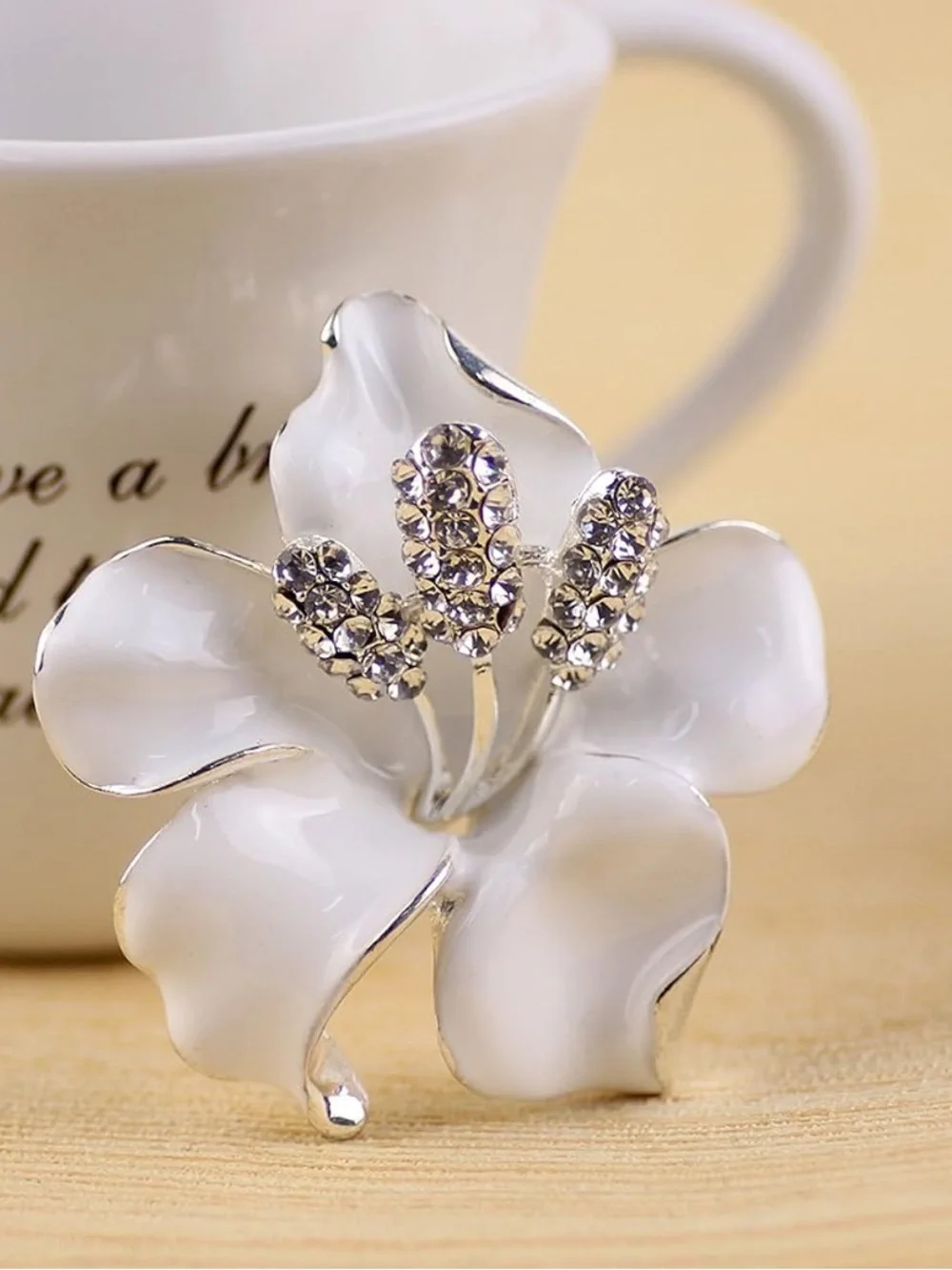 Anthropologie White Enamel Flower Brooch with Crystal Centers